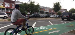 Cyclist on Two-Way Protected Bike Lane on 111th St, Queens