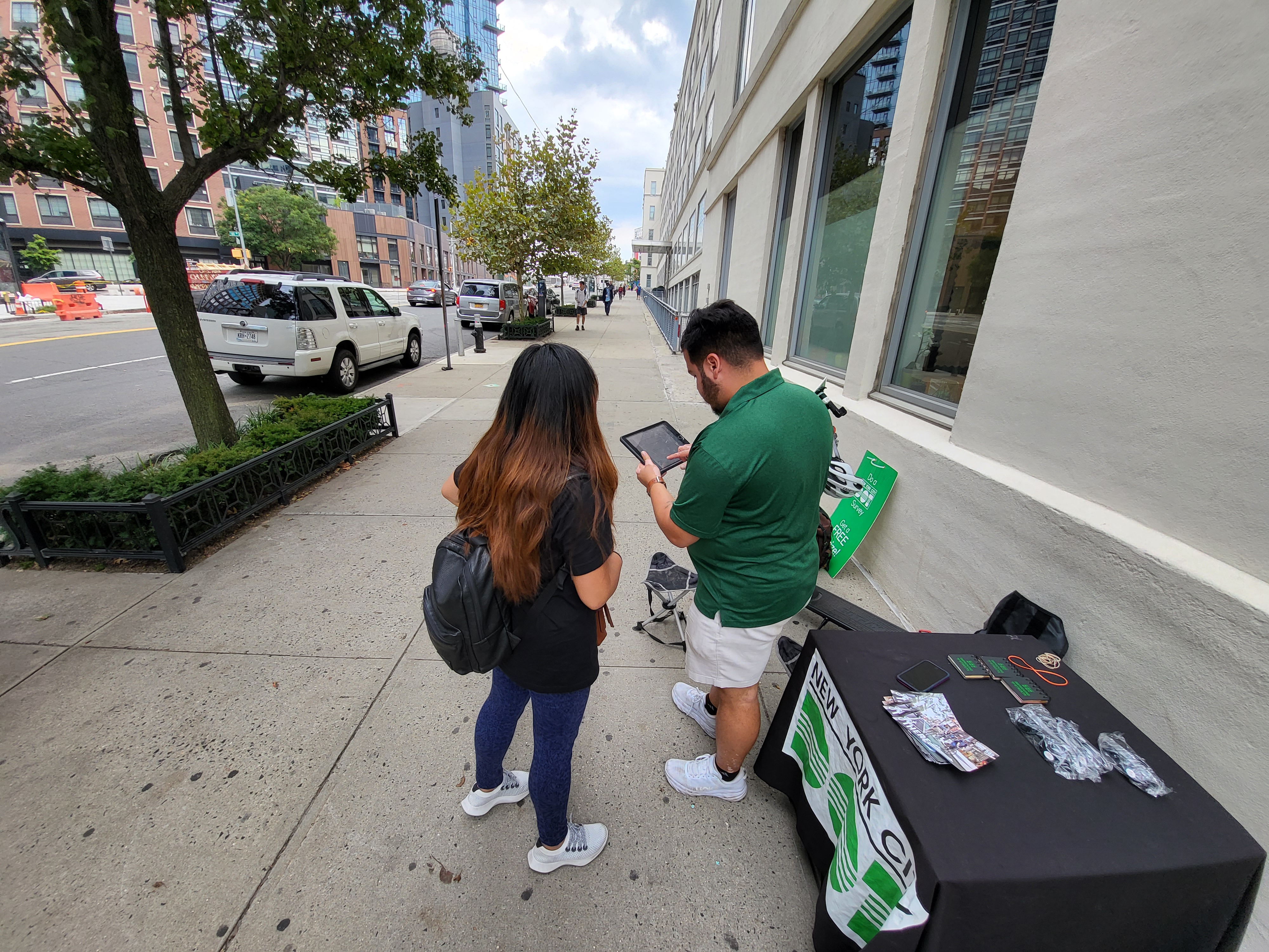 Survey participant and NYC DOT Street Ambassador taking a survey on public realm improvements in Long Island City