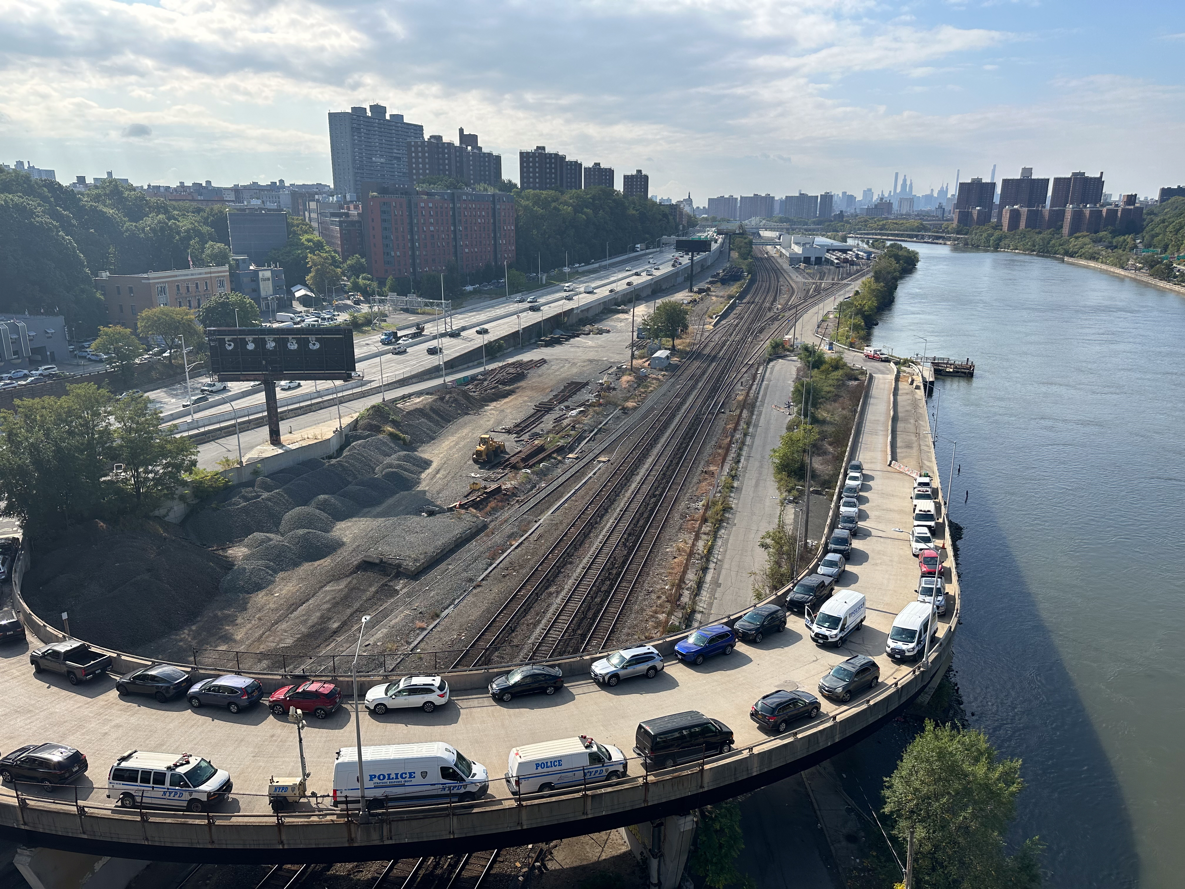 Aerial shot capturing cars parked along Depot Place bridge.