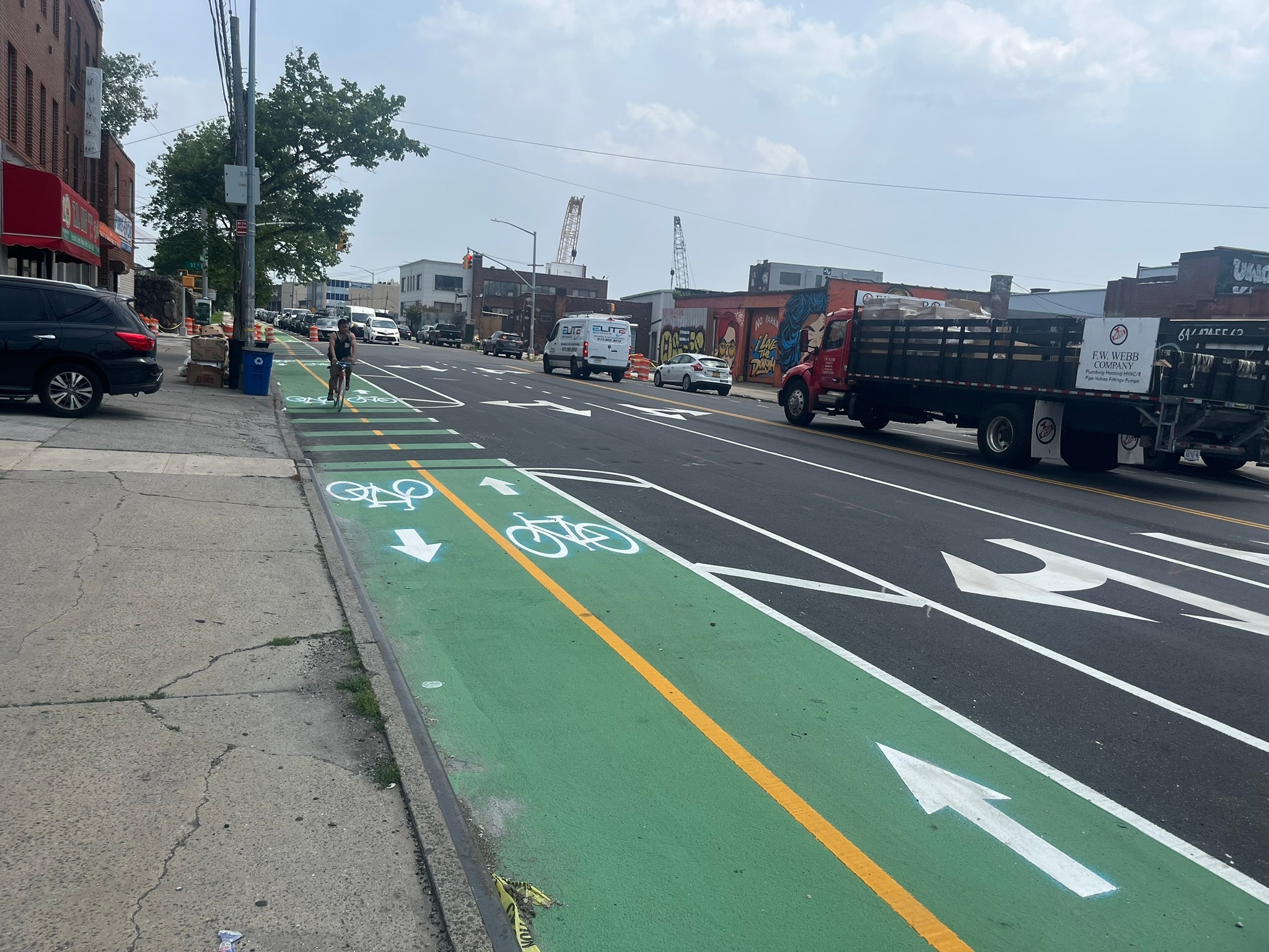 Photo of cyclist riding on two-way path along Review Avenue.