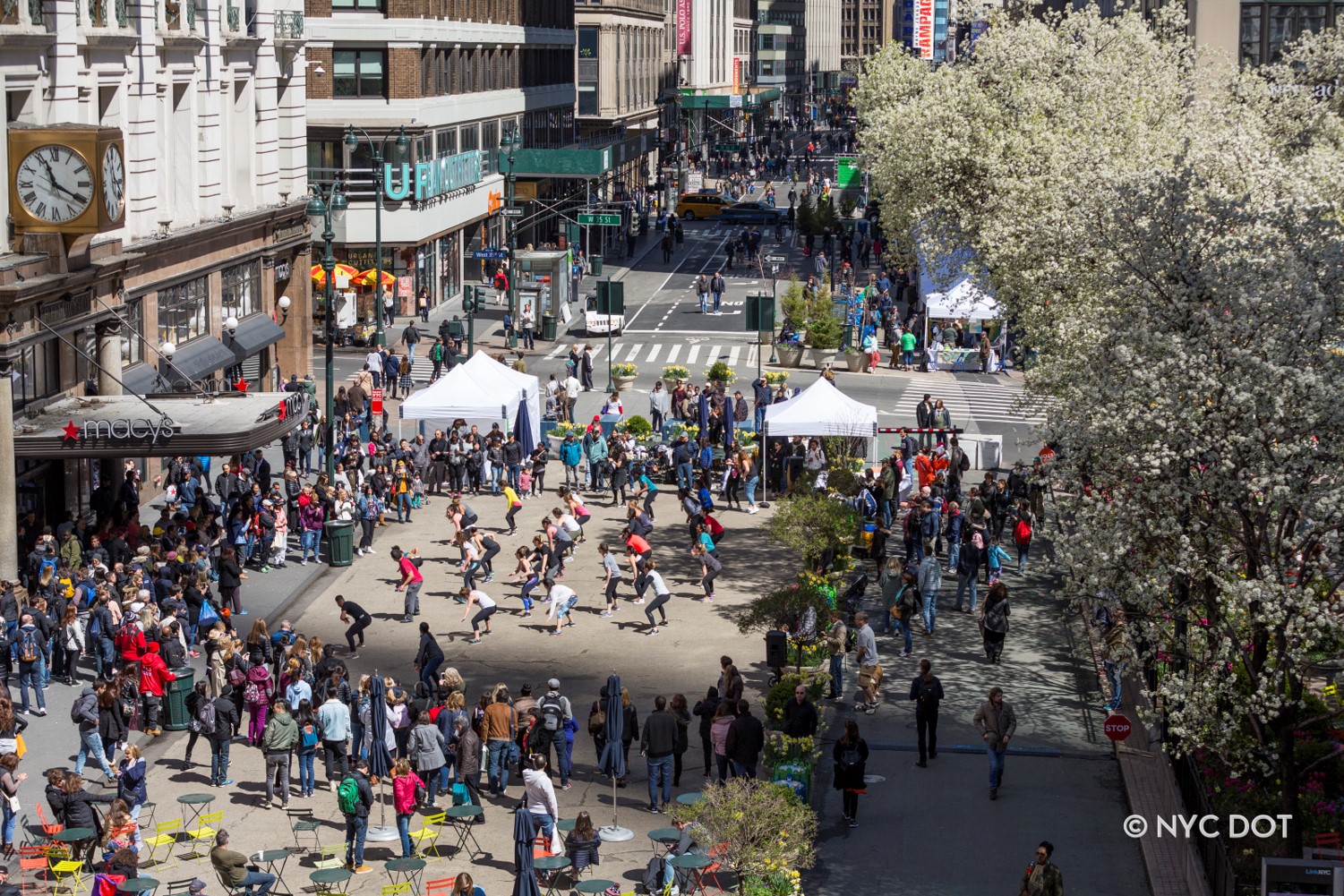 A birds eye view of people participating in a dance program at Herald Square