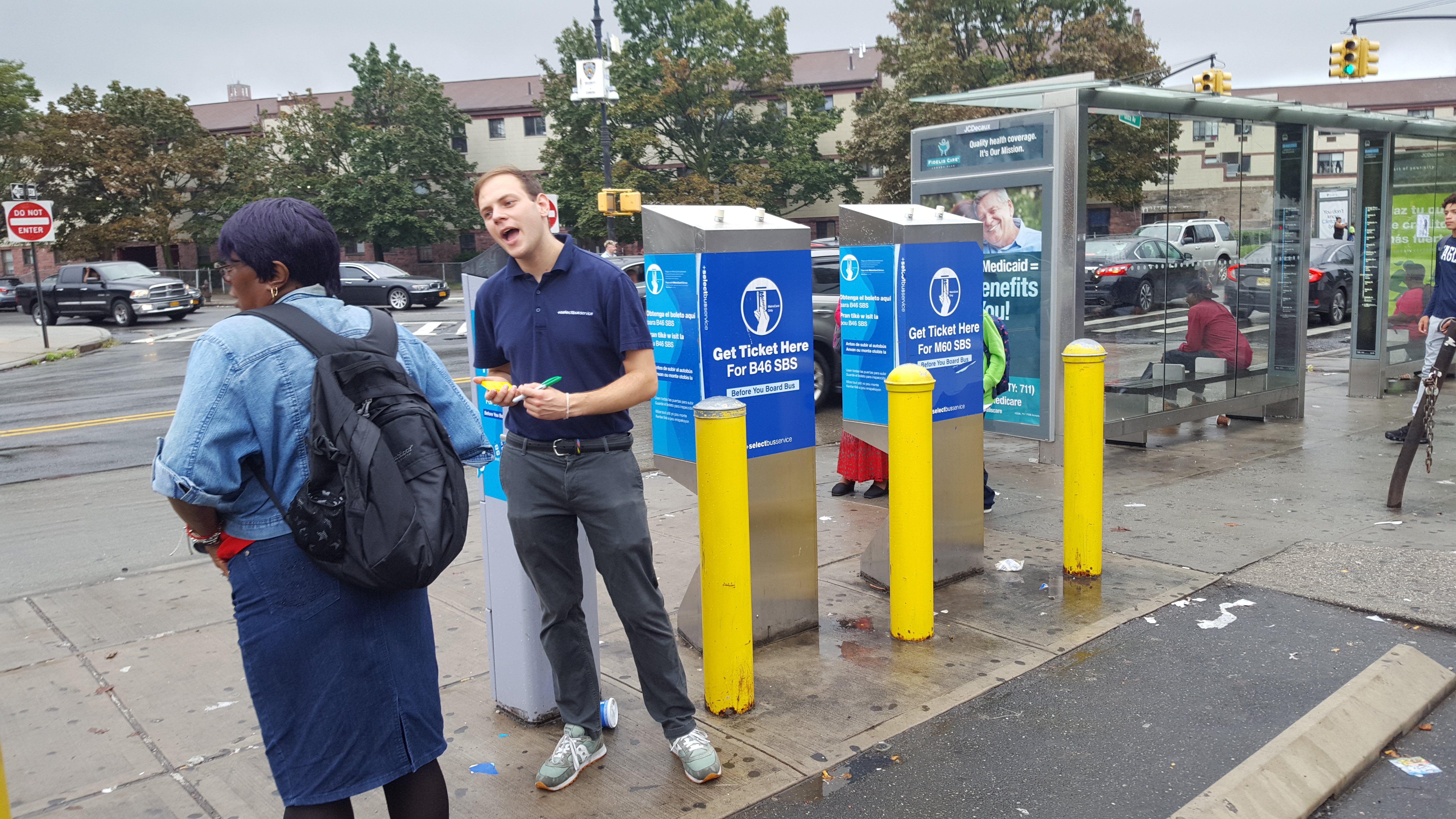 Ryan talks to a B46 commuter waiting for the SB bus