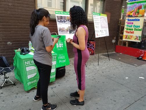 A Street Ambassador surveys a Bed Stuy resident.