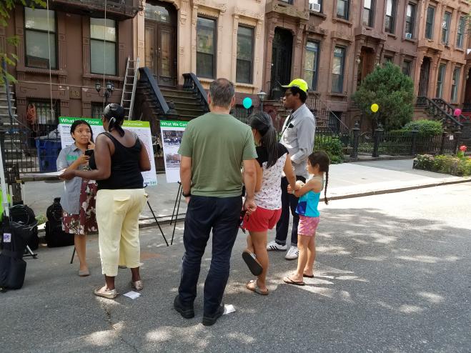 Street Ambassadors discuss transportation improvements with residents of Bed Stuy at the Hancock Block Party