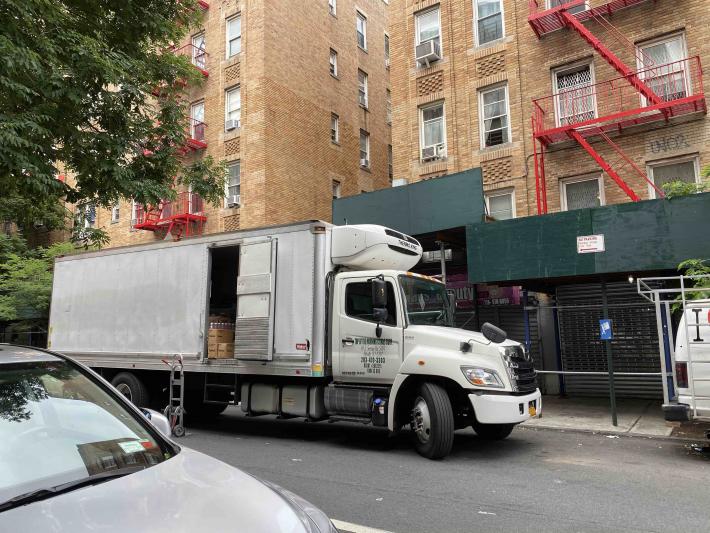 Box Truck unloading goods on Neighborhood Loading Zone in The Bronx