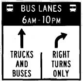 Busway Signage shows through arrow for trucks and buses and a right turn only arrow for all other traffic