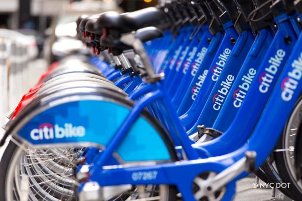 A set of Citi Bikes in the station. The camera is focused on the names. 