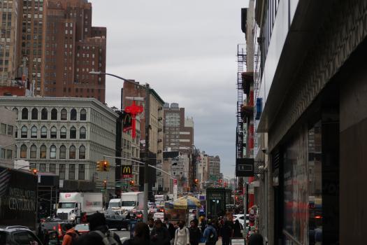 Image Description: A photo of a Canal Street sidewalk filled with pedestrians.