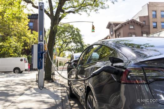 Electric vehicle being charged
