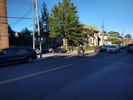 Cyclist riding bike on Ave H