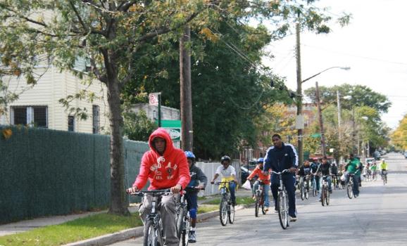 Young people ride bikes in Brownsville