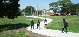 Photo of new paved path crossing the Conduit Ave median near 79th St.