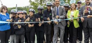 Commisioner Ydanis Rodríguez, joined by City employees and local schoolchildren, attend a ribbon cutting ceremony celebrating the launch of the Harlem River Greenway.