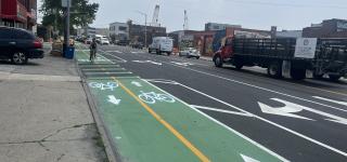 Photo of cyclist riding on two-way path along Review Avenue.