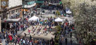 A birds eye view of people participating in a dance program at Herald Square